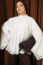 https://cdn.pazarium.com.tr/yaka-buzgulu-oversize-tunik-beyaz-801173-19-B.jpg