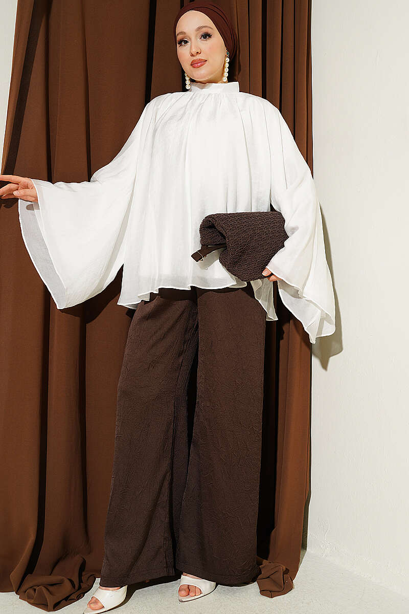 https://cdn.pazarium.com.tr/yaka-buzgulu-oversize-tunik-beyaz-801175-19-B.jpg