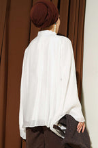 https://cdn.pazarium.com.tr/yaka-buzgulu-oversize-tunik-beyaz-801179-19-B.jpg