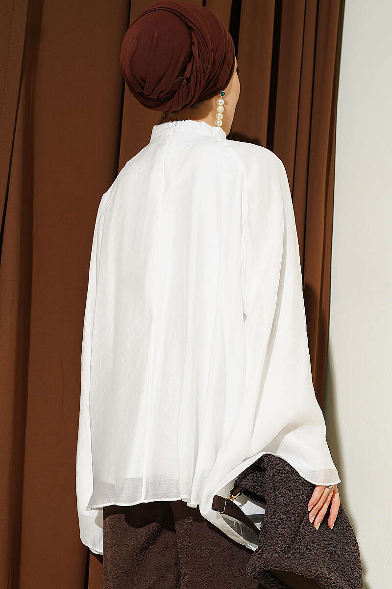 https://cdn.pazarium.com.tr/yaka-buzgulu-oversize-tunik-beyaz-801179-19-B.jpg