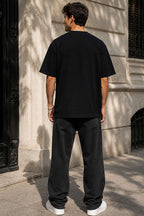 https://cdn.pazarium.com.tr/yaka-cicek-nakisli-erkek-oversize-t-shirt-siyah-785569-19-B.jpg