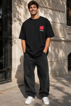 https://cdn.pazarium.com.tr/yaka-cicek-nakisli-erkek-oversize-t-shirt-siyah-785570-19-B.jpg