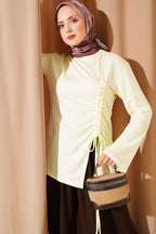 https://cdn.pazarium.com.tr/yan-ip-buzgulu-tunik-sari-812377-20-B.jpg