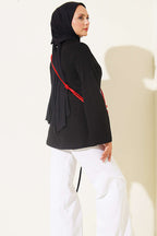 https://cdn.pazarium.com.tr/yan-ip-buzgulu-tunik-siyah-812383-20-B.jpg
