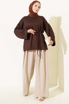 https://cdn.pazarium.com.tr/yan-yirtmacli-duble-kol-tunik-aci-kahve-804604-19-B.jpg