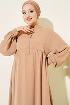 https://cdn.pazarium.com.tr/yarim-dugmeli-oversize-elbise-latte-817167-20-B.jpg