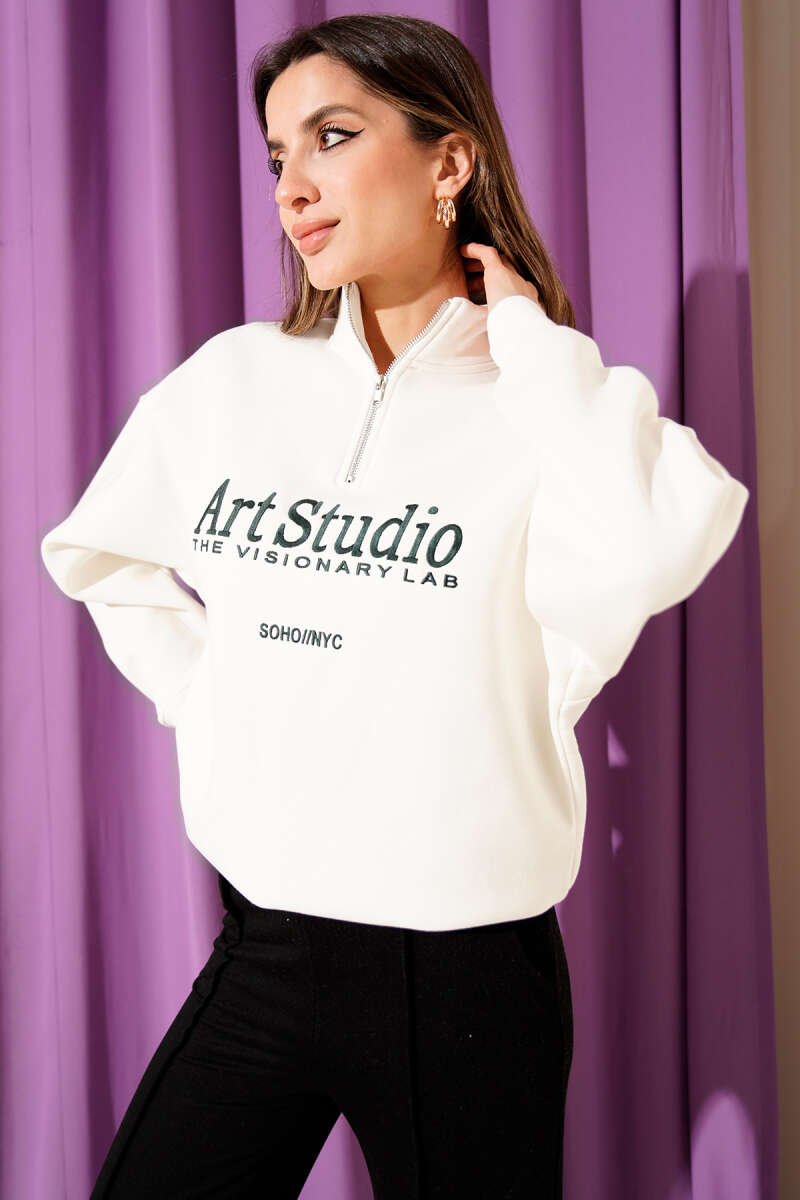 https://cdn.pazarium.com.tr/yazi-nakisli-fermuarli-sardonlu-sweatshirt-ekru-704362-17-B.jpg