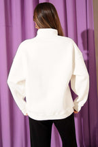 https://cdn.pazarium.com.tr/yazi-nakisli-fermuarli-sardonlu-sweatshirt-ekru-704366-17-B.jpg