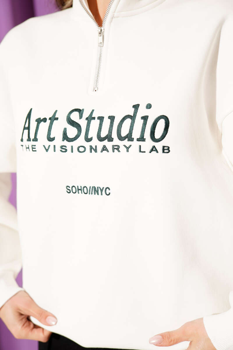 https://cdn.pazarium.com.tr/yazi-nakisli-fermuarli-sardonlu-sweatshirt-ekru-704368-17-B.jpg