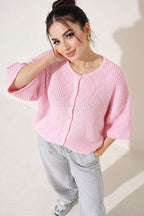 https://cdn.pazarium.com.tr/yirtmac-detayli-triko-kisa-hirka-pembe-839424-20-B.jpg