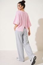 https://cdn.pazarium.com.tr/yirtmac-detayli-triko-kisa-hirka-pembe-839425-20-B.jpg